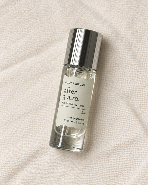 03 after 3 a.m. body perfume, 10ml bottle on warm linen