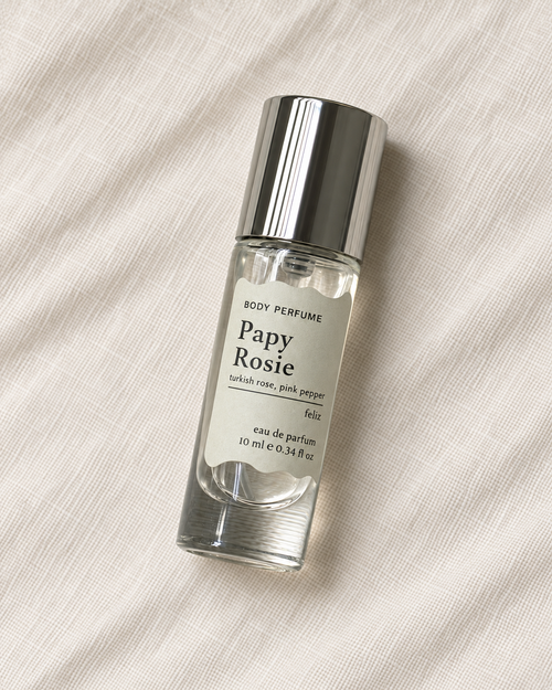 02 Papy ~ Rosie body perfume, 10ml bottle on warm linen