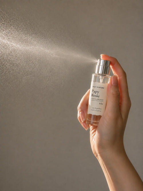 02 Papy ~ Rosie perfume being sprayed, with mist visible