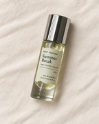 04 Summer Break body perfume, 10ml bottle on warm linen