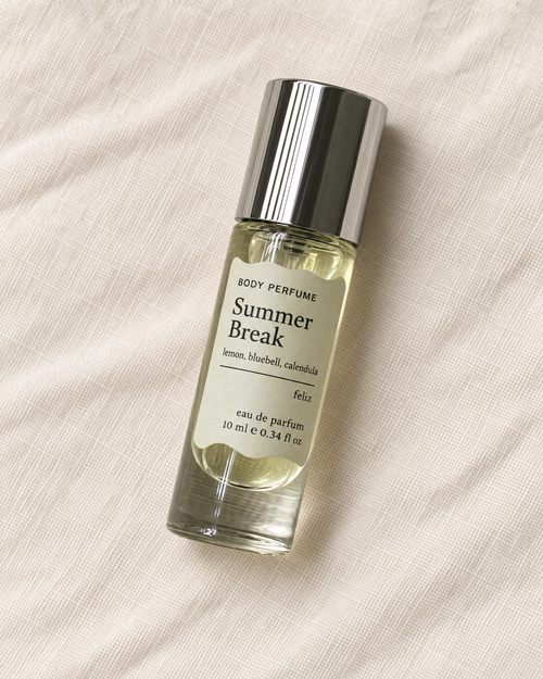04 Summer Break body perfume, 10ml bottle on warm linen